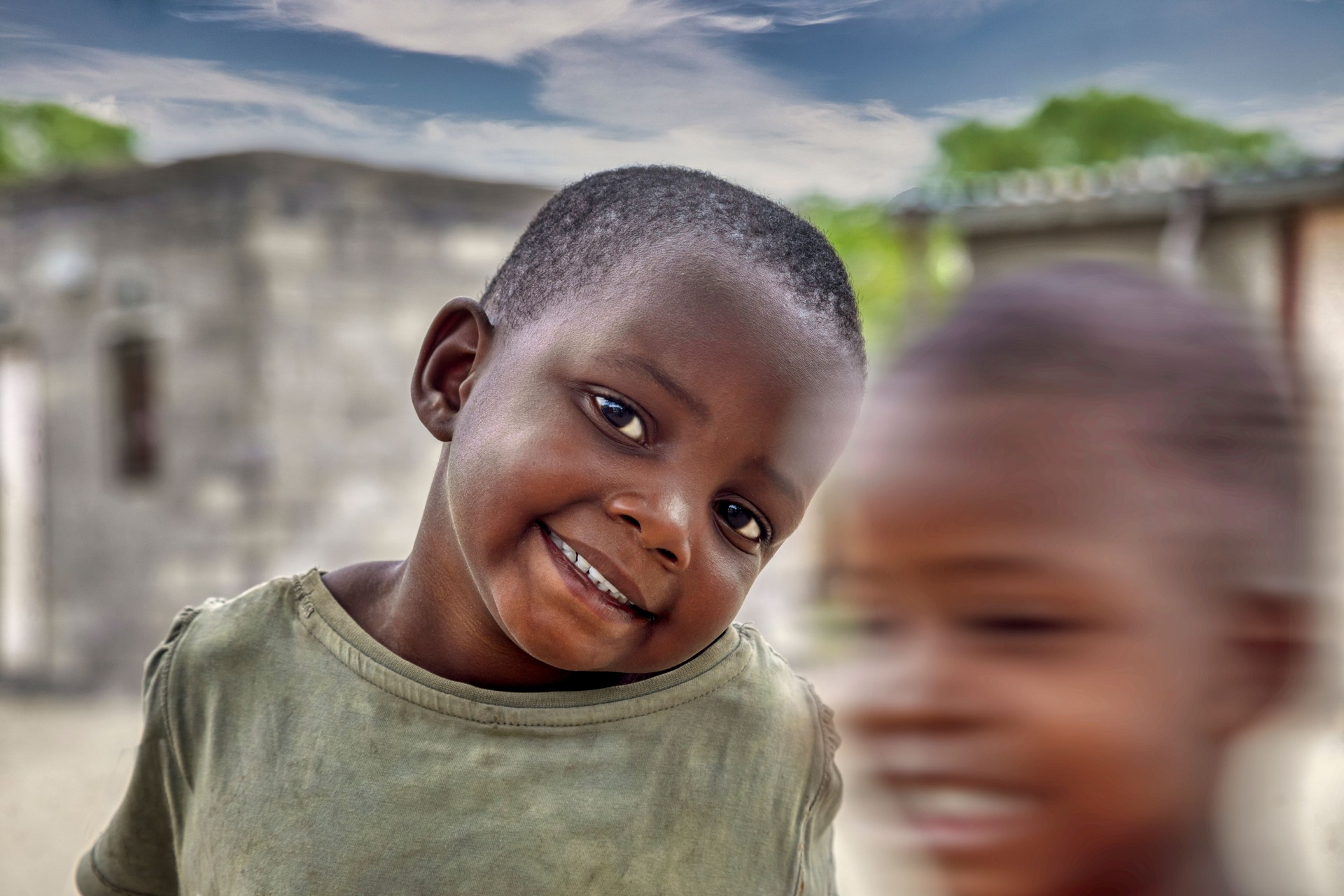 Smiling African children playing in the yard
